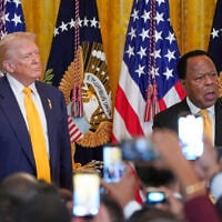 FILE: US President Donald Trump listens as Leo Terrell speaks during a Black History Month event in the East Room of the White House, February 18, 2026, in Washington. (AP Photo/Nathan Howard)