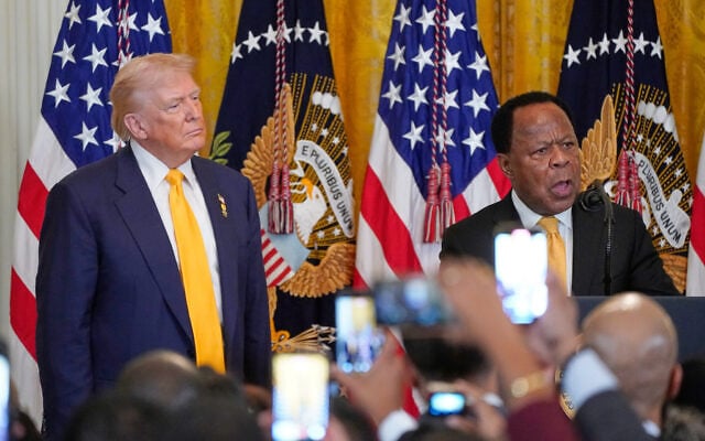 FILE: US President Donald Trump listens as Leo Terrell speaks during a Black History Month event in the East Room of the White House, February 18, 2026, in Washington. (AP Photo/Nathan Howard) FILE: US President Donald Trump listens as Leo Terrell speaks during a Black History Month event in the East Room of the White House, February 18, 2026, in Washington. (AP Photo/Nathan Howard)