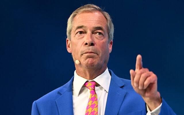 Reform Party Leader Nigel Farage points as he speaks during the Reform party’s annual conference at the National Exhibition Centre in Birmingham, England, September 4, 2026. (AP Photo/Thomas Krych)