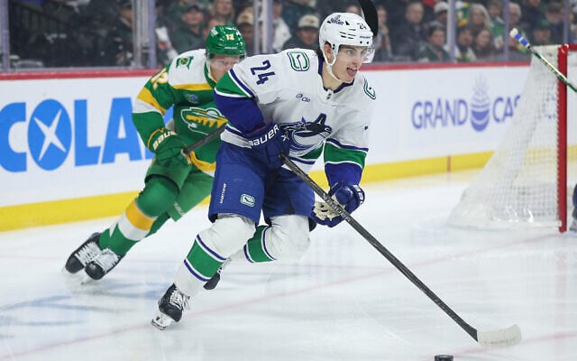 Vancouver Canucks defenseman Zeev Buium (24) skates with the puck during the first period of an NHL hockey game April 2, 2026, in St. Paul, Minn. (AP Photo/Matt Krohn)