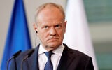 Polish Prime Minister Donald Tusk looks on during a press conference during the E5 summit of leading European nations ahead of the upcoming NATO summit, in Berlin, June 24, 2026. (Kay Nietfeld/dpa via AP)