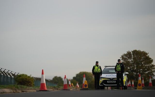 Police officers guard a road leading to RAF Fairford, after an incident in Fairford, England, September 28, 2026. (AP Photo/Alastair Grant) Police officers guard a road leading to RAF Fairford, after an incident in Fairford, England, September 28, 2026. (AP Photo/Alastair Grant)