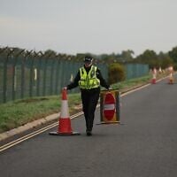 Police officers guard a road leading to RAF Fairford, after an incident in Fairford, England, September 28, 2026. (Alastair Grant/AP)
