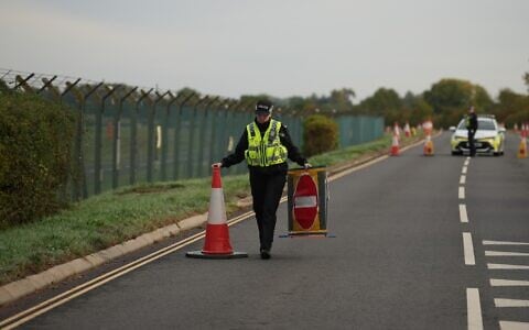 Police officers guard a road leading to RAF Fairford, after an incident in Fairford, England, September 28, 2026. (Alastair Grant/AP)