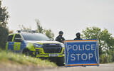Police guard a road leading to RAF Fairford, in Fairford, England, September 28, 2026. (Alastair Grant/AP)