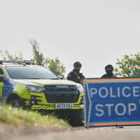 Police guard a road leading to RAF Fairford, in Fairford, England, September 28, 2026. (Alastair Grant/AP)