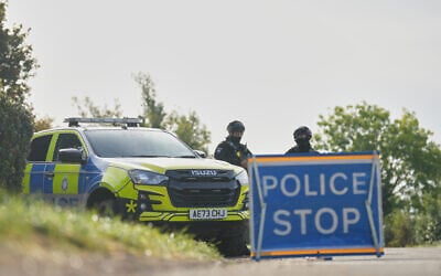Police guard a road leading to RAF Fairford, in Fairford, England, September 28, 2026. (Alastair Grant/AP)