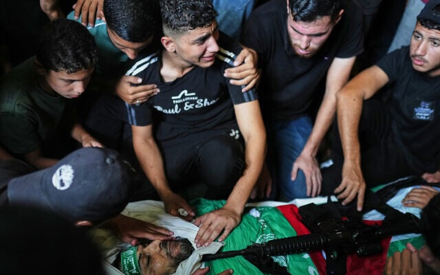 Palestinians mourn around the body of Hamas militant Izz al-Din al-Bik, draped in the group’s flag with a rifle placed on top, during his funeral after he was killed in an Israeli airstrike in Gaza City, September 29, 2026. (AP Photo/Jehad Alshrafi) Palestinians mourn around the body of Hamas militant Izz al-Din al-Bik, draped in the group’s flag with a rifle placed on top, during his funeral after he was killed in an Israeli airstrike in Gaza City, September 29, 2026. (AP Photo/Jehad Alshrafi)