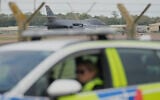 A B1 bomber prepares to take off as police officers man a checkpoint near RAF Fairford air base, in Fairford, England September 29, 2026. (AP Photo/Alastair Grant)