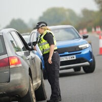 British police officers stand at a checkpoint near RAF Fairford airbase, in Fairford, England September 29, 2026. (AP Photo/Alastair Grant)
