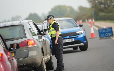 British police officers stand at a checkpoint near RAF Fairford airbase, in Fairford, England September 29, 2026. (AP Photo/Alastair Grant)
