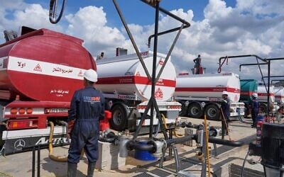 Workers load tanker trucks with gasoline pumped ashore from oil tankers and held in storage tanks at the Baniyas Oil Terminal in Baniyas, Syria, September 29, 2026. (AP/Omar Albam) Workers load tanker trucks with gasoline pumped ashore from oil tankers and held in storage tanks at the Baniyas Oil Terminal in Baniyas, Syria, September 29, 2026. (AP/Omar Albam)