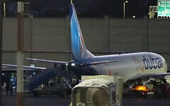 People disembark from a flydubai carrying Israeli passengers who had earlier been aboard another flight that came under an attempted terror attack, Ben Gurion Airport, September 30, 2026. (AP Photo/Ariel Schalit)