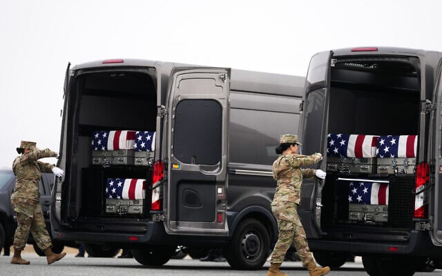 Door attendants secure the doors of the transfer vans containing the remains of US Army Reserve soldiers Maj. Jeffrey O’Brien, Maj. Cody Khork, Chief Warrant Officer 3 Robert Marzan, Master Sgt. Class Nicole Amor, Master Sgt. Class Noah Tietjens, Sgt. Declan Coady, during a casualty return, March 7, 2026, at Dover Air Force Base, Delaware, who were killed in a drone strike at a command center in Kuwait after the US and Israel launched its military campaign against Iran. (AP Photo/Mark Schiefelbein) Door attendants secure the doors of the transfer vans containing the remains of US Army Reserve soldiers Maj. Jeffrey O’Brien, Maj. Cody Khork, Chief Warrant Officer 3 Robert Marzan, Master Sgt. Class Nicole Amor, Master Sgt. Class Noah Tietjens, Sgt. Declan Coady, during a casualty return, March 7, 2026, at Dover Air Force Base, Delaware, who were killed in a drone strike at a command center in Kuwait after the US and Israel launched its military campaign against Iran. (AP Photo/Mark Schiefelbein)