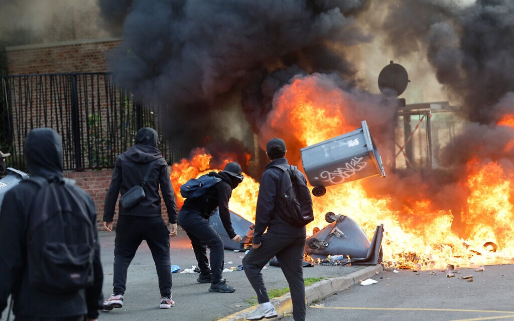 Students burn garbage as they protest to demand more resources at school, in Lille, France, October 1, 2026. (AP Photo/Jean-Francois Badias)