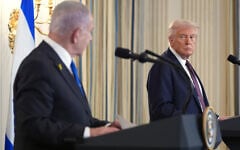US President Donald Trump, right, listens during a news conference with Israeli Prime Minister Benjamin Netanyahu in the State Dining Room of the White House, September 29, 2025, in Washington. (AP Photo/Evan Vucci)