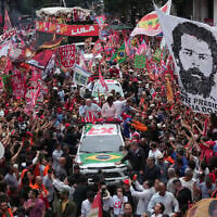 Brazilian President Luiz Inacio Lula da Silva, who is running for reelection, center, accompanied by Senate candidates Benedita da Silva, right, and Pedro Paulo, attends a campaign rally in Rio de Janeiro, Brazil, October 2, 2026. (AP Photo/Silvia Izquierdo)