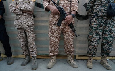 Men affiliated with the Islamic Revolutionary Guard Corps stand during the opening ceremony of one of the military training centers for volunteers being set up throughout squares in downtown Tehran, Iran, October 3, 2026. (AP Photo/Vahid Salemi) Men affiliated with the Islamic Revolutionary Guard Corps stand during the opening ceremony of one of the military training centers for volunteers being set up throughout squares in downtown Tehran, Iran, October 3, 2026. (AP Photo/Vahid Salemi)