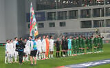 Irish players bow their heads during Israeli national anthem before the UEFA Nations League soccer match between the Republic of Ireland and Israel in Backa Topola, Serbia, October 4, 2026. (AP Photo/Darko Vojinovic)