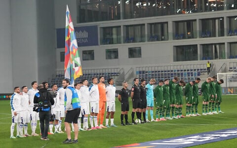 Irish players bow their heads during Israeli national anthem before the UEFA Nations League soccer match between the Republic of Ireland and Israel in Backa Topola, Serbia, October 4, 2026. (AP Photo/Darko Vojinovic)