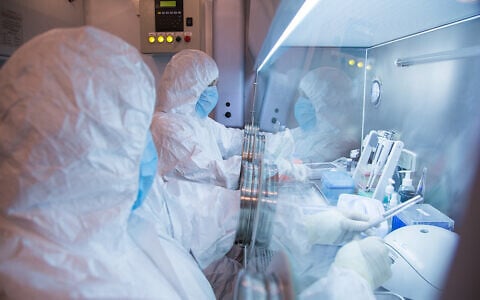This undated photo released by the Irkutsk Anti-Plague Research Institute of Siberia and Far East shows the institute workers in a lab. (The Irkutsk Anti-Plague Research Institute of Siberia and Far East via AP)