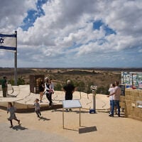 Visitors gather on a hill overlooking the Gaza Strip, in Sderot, southern Israel, October 1, 2026. (AP Photo/Oded Balilty)