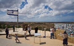 Visitors gather on a hill overlooking the Gaza Strip, in Sderot, southern Israel, October 1, 2026. (AP Photo/Oded Balilty)