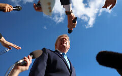 President Donald Trump speaks to reporters before boarding Marine One on the South Lawn of the White House, October 5, 2026, in Washington. (AP Photo/Tom Brenner)