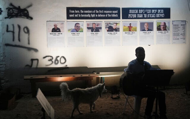 People attend a memorial service marking the third anniversary of the October 7, 2023, Hamas cross-border attack on Israel, in Kibbutz Kfar Aza, southern Israel, where many community members were killed and abducted, October 7, 2026. (AP Photo/Ariel Schalit)