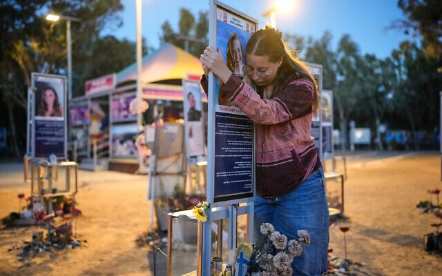 Raz Zarfati, sister of Ron Zarfati who was killed in the October 7, 2023, Hamas attack on Israel, attend a memorial marking the third anniversary of the attack at the Nova music festival site near Kibbutz Reim, southern Israel, October 7, 2026. (AP Photo/Ohad Zwigenberg)