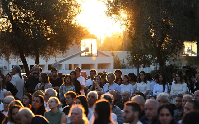 People attend a memorial service marking the third anniversary of the October 7, 2023, Hamas cross-border attack on Israel, in Kibbutz Kfar Aza, southern Israel, where many community members were killed and abducted, October 7, 2026. (AP Photo/Ariel Schalit)