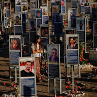 People mark the third anniversary of the October 7, 2023, Hamas attack on Israel at the site of the Nova music festival, where hundreds of revelers were killed and abducted, near Kibbutz Re'im, southern Israel, October 7, 2026. (AP Photo/Ohad Zwigenberg)