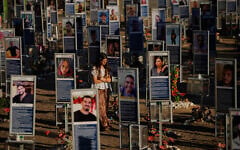 People mark the third anniversary of the October 7, 2023, Hamas attack on Israel at the site of the Nova music festival, where hundreds of revelers were killed and abducted, near Kibbutz Re'im, southern Israel, October 7, 2026. (AP Photo/Ohad Zwigenberg)