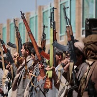 Houthi supporters carry their rifles while attending an armed tribal rally in Sanaa, Yemen, October 7, 2026. (AP Photo/Osamah Abdulrahman)
