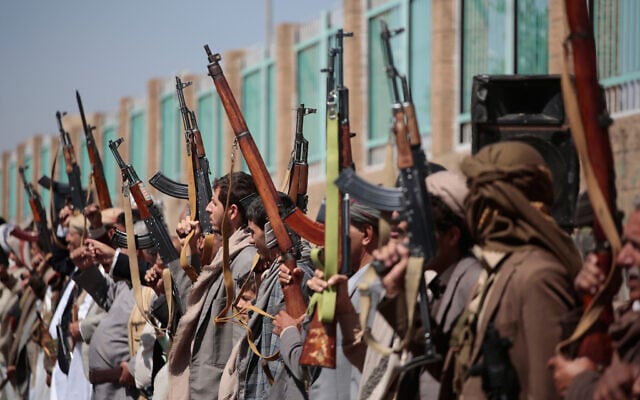Houthi supporters carry their rifles while attending an armed tribal rally in Sanaa, Yemen, October 7, 2026. (AP Photo/Osamah Abdulrahman)
