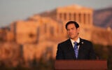 US Secretary of State Marco Rubio speaks at the Pnyx hill, where ancient Athenians held democratic assemblies, with the ancient Parthenon temple atop the Acropolis in the background, in Athens, October 7, 2026. (AP Photo/Mark Schiefelbein, Pool)