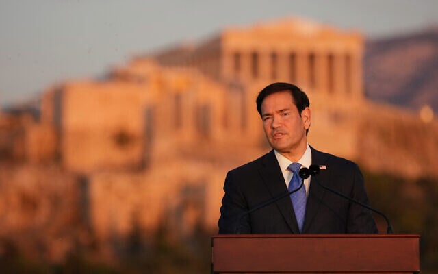 US Secretary of State Marco Rubio speaks at the Pnyx hill, where ancient Athenians held democratic assemblies, with the ancient Parthenon temple atop the Acropolis in the background, in Athens, October 7, 2026. (AP Photo/Mark Schiefelbein, Pool) US Secretary of State Marco Rubio speaks at the Pnyx hill, where ancient Athenians held democratic assemblies, with the ancient Parthenon temple atop the Acropolis in the background, in Athens, October 7, 2026. (AP Photo/Mark Schiefelbein, Pool)
