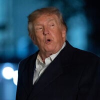 US President Donald Trump talks to reporters as he walks on the South Lawn upon his arrival to the White House, October 8, 2026, in Washington. (AP/Jose Luis Magana)