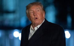 US President Donald Trump talks to reporters as he walks on the South Lawn upon his arrival to the White House, October 8, 2026, in Washington. (AP Photo/Jose Luis Magana)