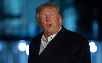 US President Donald Trump talks to reporters as he walks on the South Lawn upon his arrival to the White House, October 8, 2026, in Washington. (AP/Jose Luis Magana)
