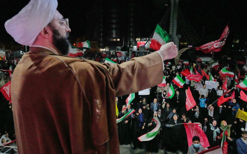 A cleric leads demonstrators in a pro-government gathering at a square in Tehran, October 8, 2026. (AP Photo/Vahid Salemi) A cleric leads demonstrators in a pro-government gathering at a square in Tehran, October 8, 2026. (AP Photo/Vahid Salemi)