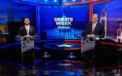 Democratic nominee for US Senate Abdul El-Sayed, left, appears with Republican nominee for US Senate Mike Rogers during a televised debate at WOOD-TV, on October 8, 2026, in Grand Rapids, Mich. (AP Photo/Paul Sancya, Pool)
