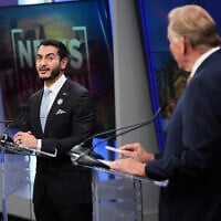 Democratic nominee for US Senate Abdul El-Sayed, left, looks over to Republican nominee for US Senate Mike Rogers during a televised debate at WOOD-TV, on October 8, 2026, in Grand Rapids, Mich. (AP/Paul Sancya)
