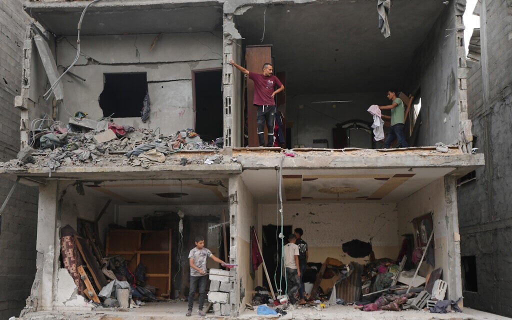 Palestinians salvage their belongings from a building destroyed by an Israeli airstrike in Gaza City, October 9, 2026. (AP Photo/Jehad Alshrafi) Palestinians salvage their belongings from a building destroyed by an Israeli airstrike in Gaza City, October 9, 2026. (AP Photo/Jehad Alshrafi)