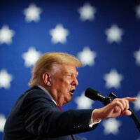 US President Donald Trump speaks at a campaign rally at the Oncenter, October 9, 2026, in Syracuse, New York. (AP Photo/Julia Demaree Nikhinson)