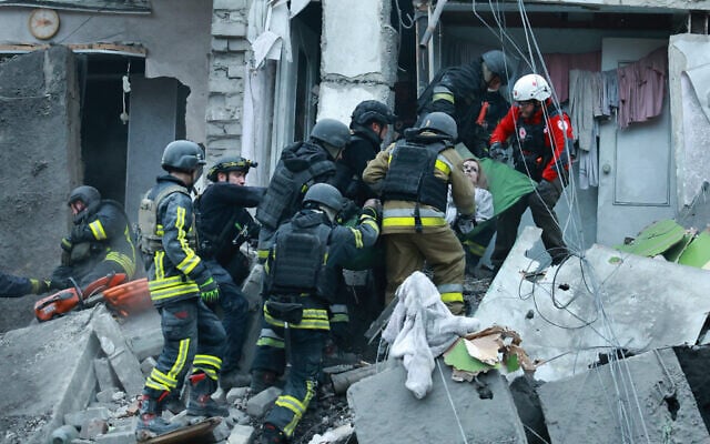 Rescue workers pull a woman from the rubble of a residential building destroyed by a Russian airstrike in Zaporizhzhia, Ukraine, October 10, 2026. (AP Photo/Kateryna Klochko) Rescue workers pull a woman from the rubble of a residential building destroyed by a Russian airstrike in Zaporizhzhia, Ukraine, October 10, 2026. (AP Photo/Kateryna Klochko)