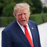 US President Donald Trump speaks to members of the media before departing on Marine One from the South Lawn of the White House, October 10, 2026, in Washington. (AP Photo/Nathan Howard)