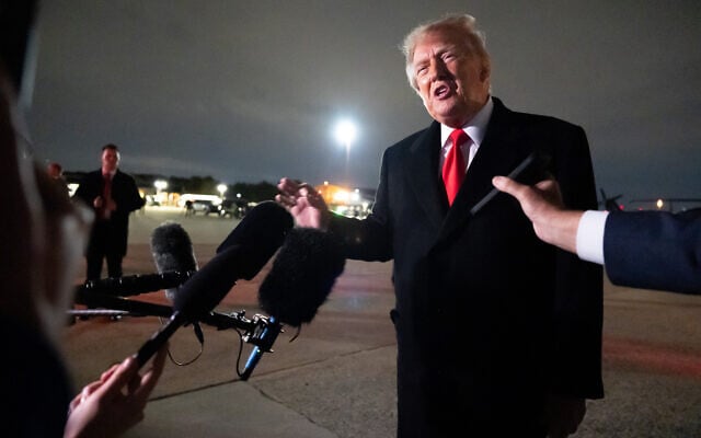 US President Donald Trump speaks with reporters as he arrives on Air Force One, October 10, 2026, at Joint Base Andrews, Maryland. (AP Photo/Alex Brandon)