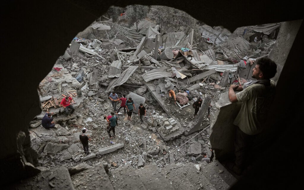 Palestinians inspect a building destroyed in an Israeli airstrike late Saturday in Zawaida, central Gaza Strip, October 11, 2026. (AP Photo/Abdel Kareem Hana) Palestinians inspect a building destroyed in an Israeli airstrike late Saturday in Zawaida, central Gaza Strip, October 11, 2026. (AP Photo/Abdel Kareem Hana)