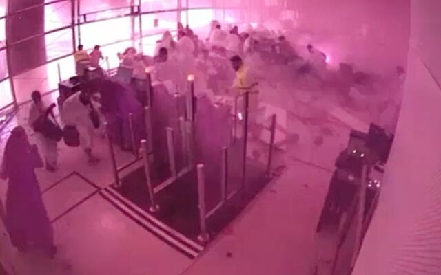 This image from CCTV video released by Saudi Arabia’s Media Ministry shows passengers taking cover as flames and smoke fill part of King Khalid International Airport in Riyadh, Saudi Arabia, during what authorities described as a strike at the airport on October 10, 2026. (Saudi Media Ministry via AP) This image from CCTV video released by Saudi Arabia’s Media Ministry shows passengers taking cover as flames and smoke fill part of King Khalid International Airport in Riyadh, Saudi Arabia, during what authorities described as a strike at the airport on October 10, 2026. (Saudi Media Ministry via AP)
